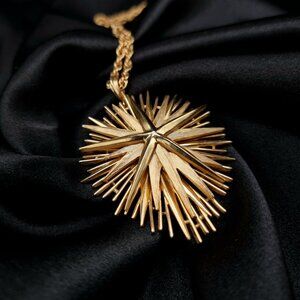 Vintage TRIFARI 1960s Gold-Tone Starburst Pendant Necklace With Rope Chain